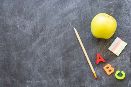 blackboard with stationery alphabet letters apple. High quality photo