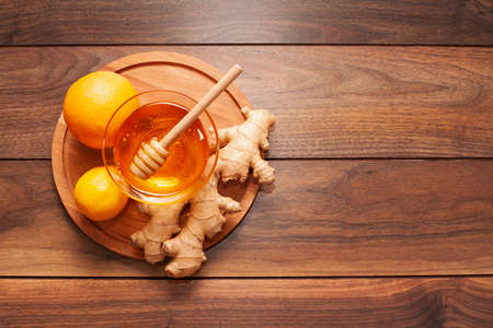 top view homemade honey with ginger lemon. High quality photo