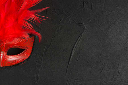 red mask dark table. High quality photoの写真素材