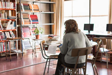 anonymous woman working library. High quality photoの写真素材