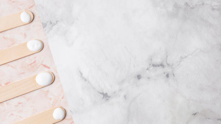 wooden sticks with cream marble background. High quality photoの写真素材