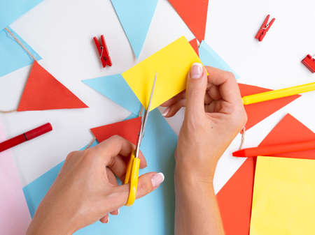 woman making paper clips decorations. High quality photoの写真素材