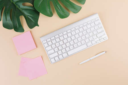 keyboard with stickers pen yellow table. High quality photo
