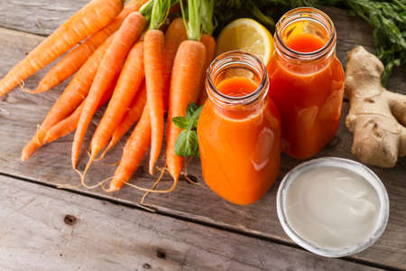 two fresh carrot smoothies. High quality photoの写真素材