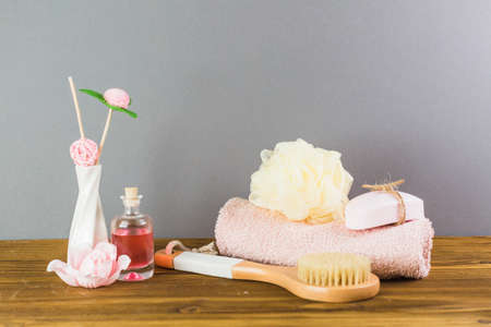 oil brush towel loofah soap wooden tabletop. High quality photoの写真素材