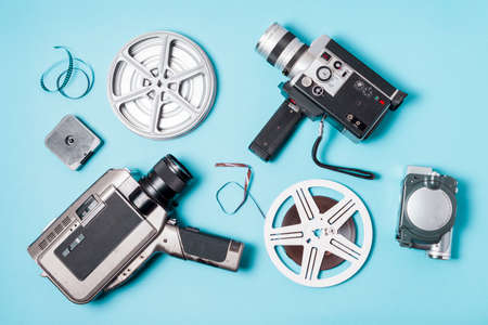 overhead view film strips film reel various type camcorder blue background. High quality photoの写真素材