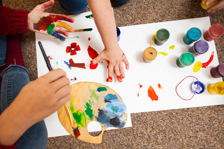 high angle child woman painting. High quality photoの写真素材