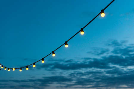 string lights sunset sky. High quality photo