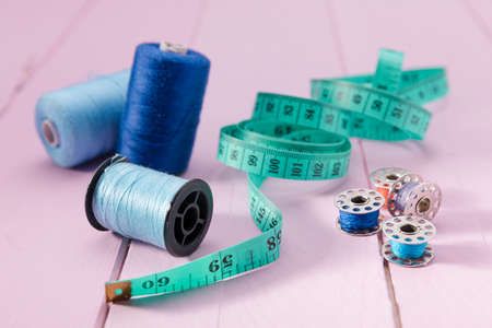high angle measuring tape thread reels sewing machine shutles. High quality photoの写真素材