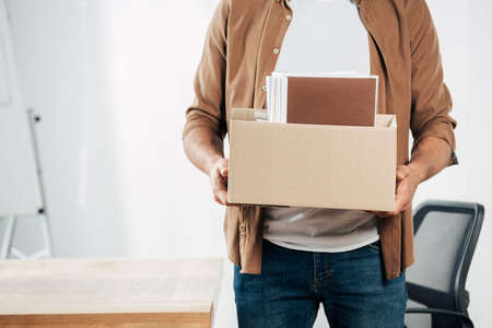 close up hands holding box with stuff. High quality photoの写真素材