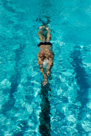high angle male swimmer swimming water pool. High quality photoの写真素材