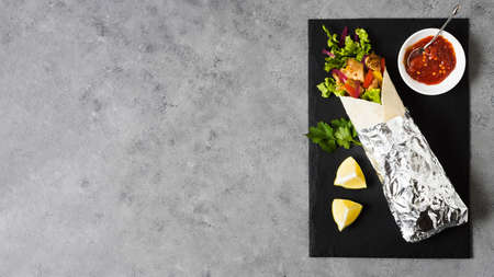 arabic kebab sandwich wrapped aluminium foil copy space. High quality photoの写真素材