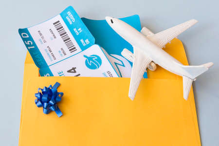 airplane tickets document case near toy aircraft. High quality photoの写真素材