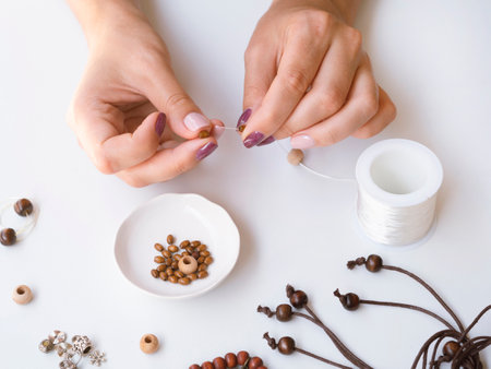 high angle woman making accessories. High quality photo