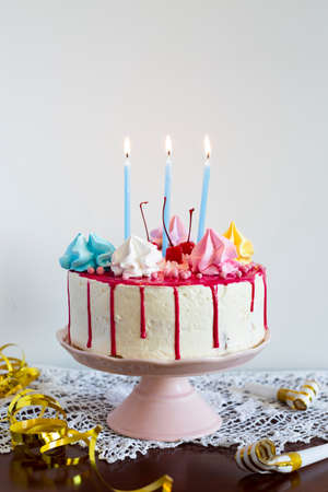 birthday cake with lit candles. High quality photoの写真素材