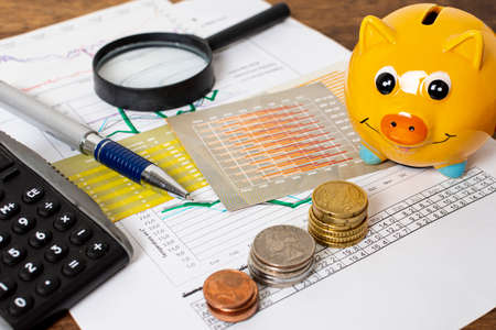 high view piggy bank piles coins. High quality photoの写真素材