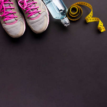 arrangement with running shoes water bottle. High quality photoの写真素材