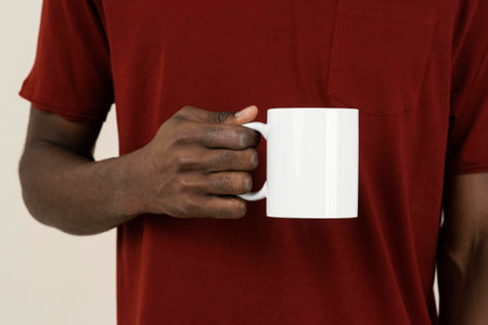front view man t shirt holding mug. High quality photoの写真素材