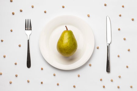 flat lay fresh pear plate with cutlery. High quality photoの写真素材