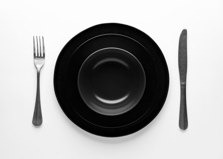 flat lay dark dinnerware cutlery. High quality photoの写真素材