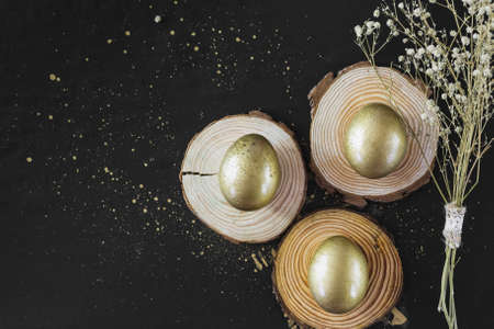 golden eggs boards near flowers. High quality photoの写真素材