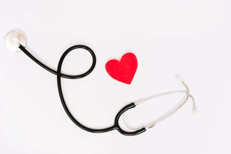 paper heart near stethoscope. High quality photo
