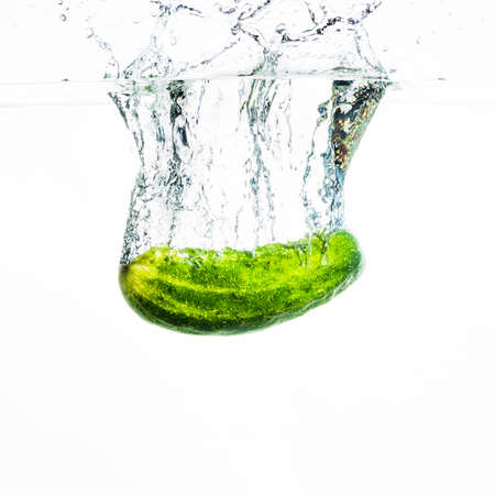 cucumber falling water water splash against white background. High quality photoの写真素材