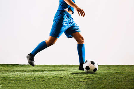 crop football player shooting ball. High quality photoの写真素材