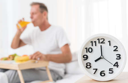 medium shot blurred man having breakfast 8 m. High quality photoの写真素材