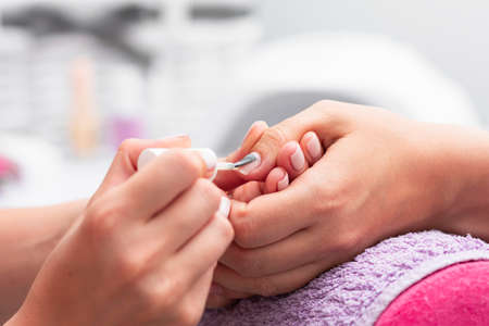 woman having her manicure done close up salon. High quality photoの写真素材