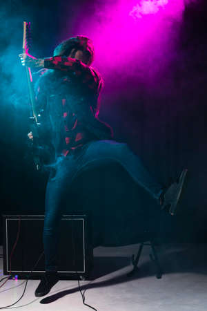 artist playing guitar dancing. High quality photoの写真素材