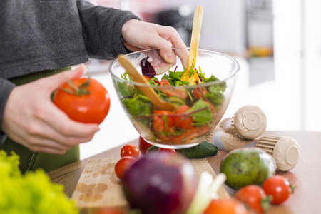 hand holding bowl salad. High quality photoの写真素材