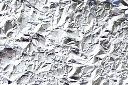 crumpled white aluminium foil background. High quality photoの写真素材