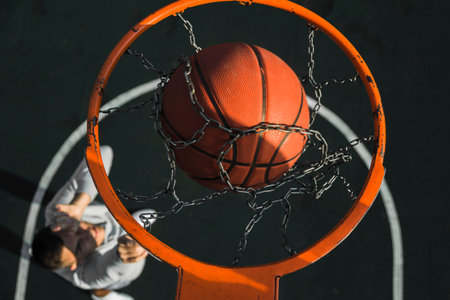 basketball falling through ring. High quality photoの写真素材