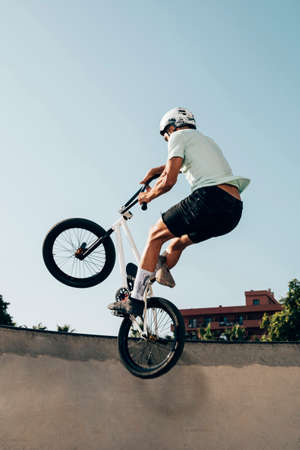 young man extreme jumping with bicycle. High quality photoの写真素材