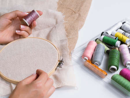 woman making decorations with wood rings. High quality photoの写真素材