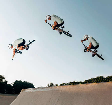young man jumping with bmx bike skate park. High quality photoの写真素材