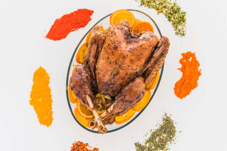 baked chicken with flavourings white table. High quality photoの写真素材