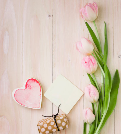 tulips with gift box paper table. High quality photoの写真素材