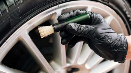 man cleaning car rims. High quality photoの写真素材