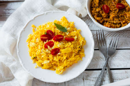 vegan indian food with rice tomatoes. High quality photoの写真素材