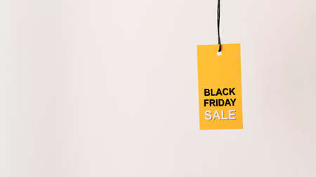 hanging yellow black friday sale label copy space. High quality photoの写真素材