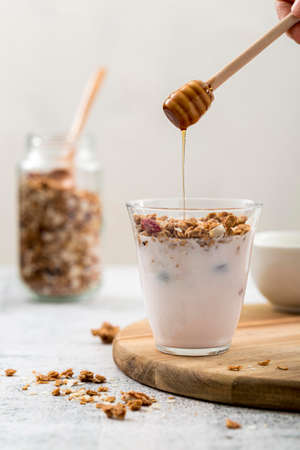 front view yogurt with granola honey. High quality photoの写真素材