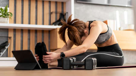 full shot woman stretching mat. High quality photoの写真素材