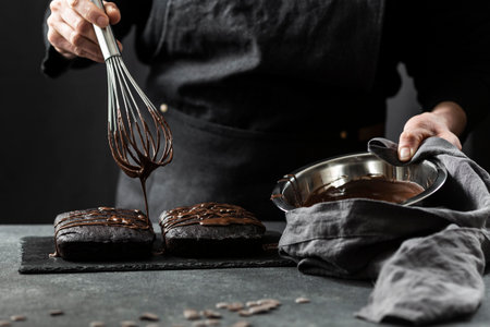 front view pastry chef preparing cake with chocolate. High quality photoの写真素材