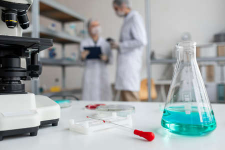 medium shot blurry scientists discussing. High quality photoの写真素材