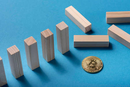 high angle domino pieces with bitcoin. High quality photoの写真素材
