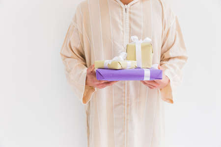 muslim man holding present boxes. High quality photoの写真素材