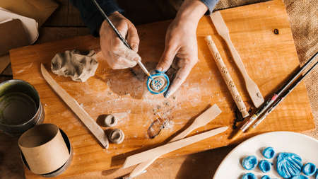 high angle man carving art pieces. High quality photoの写真素材
