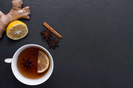 lemon tea with ginger cinnamon beside. High quality photo